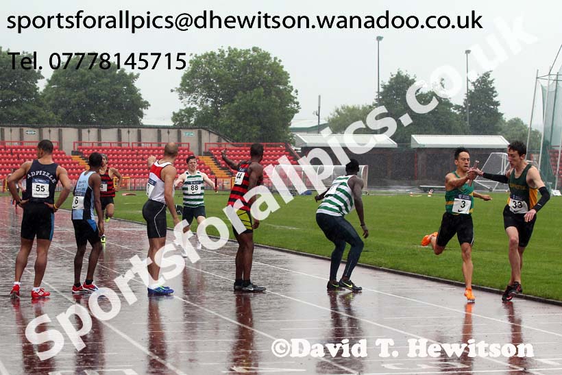 Glasgow change-over during the 4 x 400 metres relay in the worst conditions of the day, British National League, Division 1, Gateshead. Photo: David T. Hewitson/Sports for All Pics